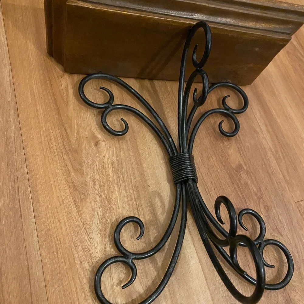Brown and black iron and wood wall shelf